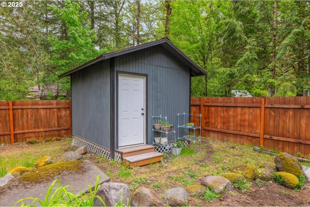 22260 E Wild Fern Ln, Brightwood, OR 97011 - view of outdoor structure featuring a fenced backyard and entry steps
