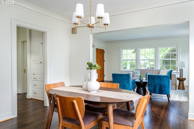 7327 N Washburne Ave, Portland, OR 97217 - dining space featuring a chandelier, wood finished floors, crown molding, and a textured ceiling
