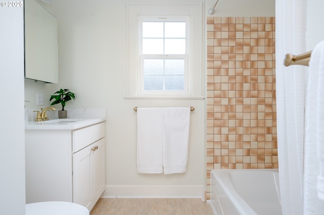 7327 N Washburne Ave, Portland, OR 97217 - bathroom with vanity, shower / bath combo, toilet, and baseboards