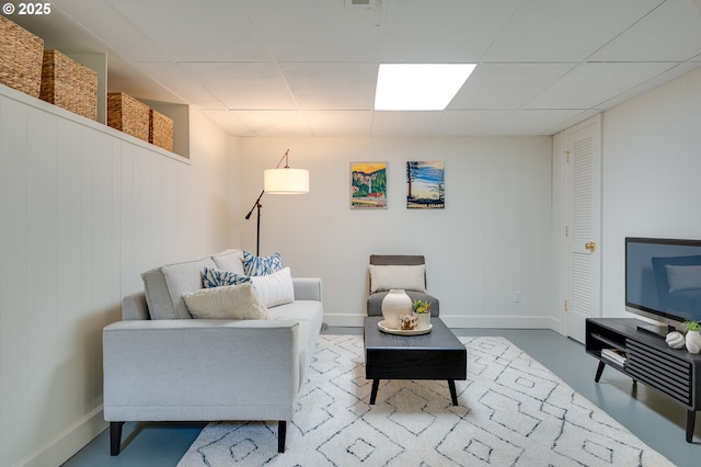 7327 N Washburne Ave, Portland, OR 97217 - living area featuring a paneled ceiling and baseboards