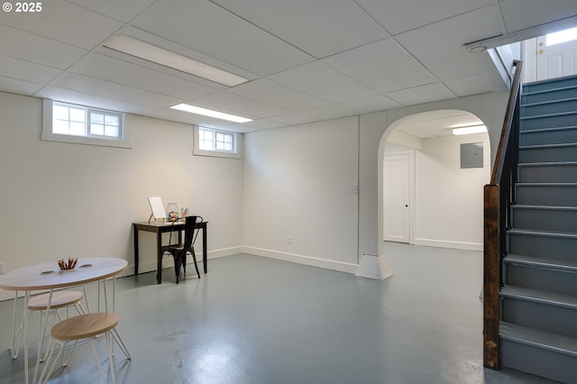 7327 N Washburne Ave, Portland, OR 97217 - below grade area with stairs, arched walkways, baseboards, and a drop ceiling