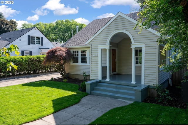 7327 N Washburne Ave, Portland, OR 97217 - bungalow featuring a front lawn and a shingled roof