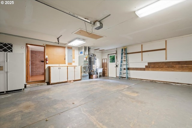 4603 SE 16th Ct, Gresham, OR 97080 - garage with a garage door opener, heating unit, electric panel, strapped water heater, and white refrigerator