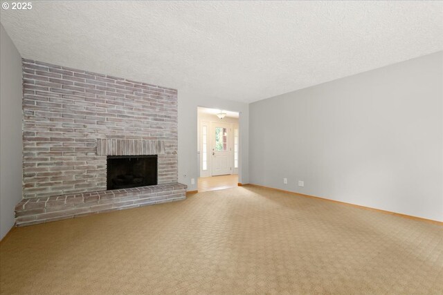 4603 SE 16th Ct, Gresham, OR 97080 - unfurnished living room with carpet flooring, a brick fireplace, and a textured ceiling