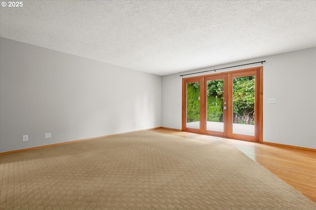 4603 SE 16th Ct, Gresham, OR 97080 - empty room with french doors, light wood-style flooring, a textured ceiling, and light colored carpet