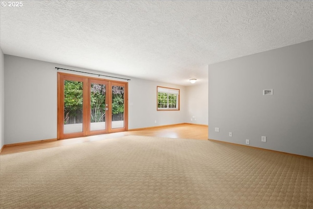 4603 SE 16th Ct, Gresham, OR 97080 - carpeted empty room featuring baseboards and a textured ceiling