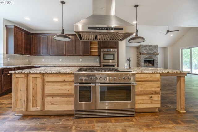 39665 SE Rude Rd, Sandy, OR 97055 - kitchen with appliances with stainless steel finishes, island range hood, ceiling fan, open floor plan, and decorative backsplash