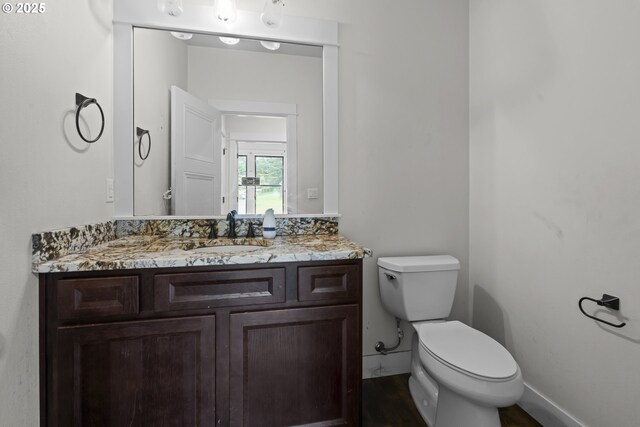 39665 SE Rude Rd, Sandy, OR 97055 - half bathroom featuring toilet, vanity, and wood finished floors