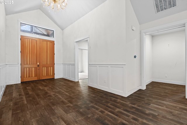39665 SE Rude Rd, Sandy, OR 97055 - foyer entrance with a chandelier, dark wood-style flooring, wainscoting, high vaulted ceiling, and a decorative wall