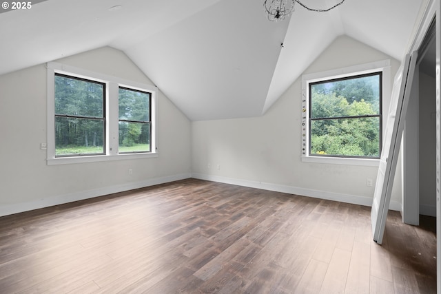 39665 SE Rude Rd, Sandy, OR 97055 - additional living space featuring healthy amount of natural light, vaulted ceiling, wood finished floors, and baseboards