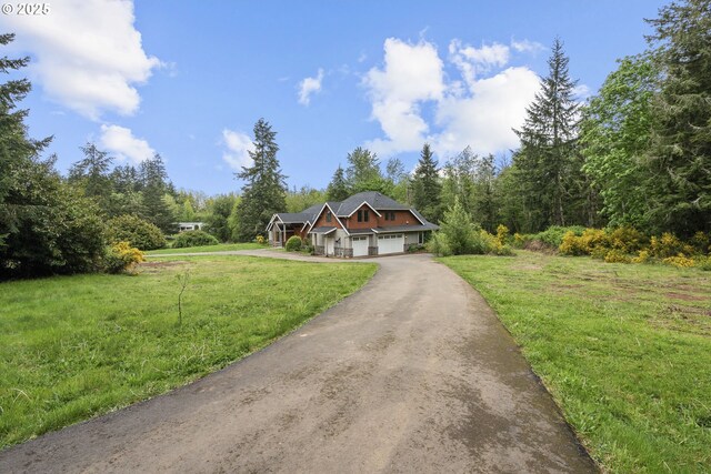 39665 SE Rude Rd, Sandy, OR 97055 - view of front of property featuring a garage, a front lawn, asphalt driveway, and a forest view