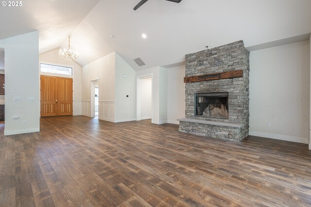 39665 SE Rude Rd, Sandy, OR 97055 - unfurnished living room with wood finished floors, a chandelier, high vaulted ceiling, and a stone fireplace