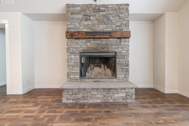 39665 SE Rude Rd, Sandy, OR 97055 - detailed view of wood finished floors, baseboards, and a stone fireplace