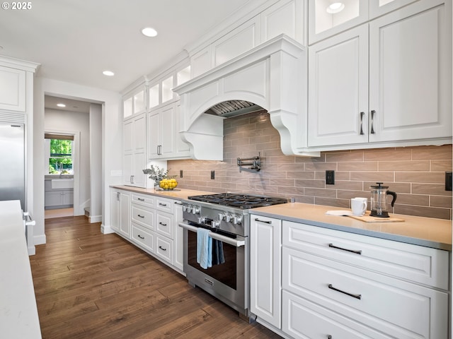 13848 SE Diamond Ridge Rd, Happy Valley, OR 97086 - kitchen with premium appliances, white cabinetry, dark wood-style floors, and recessed lighting
