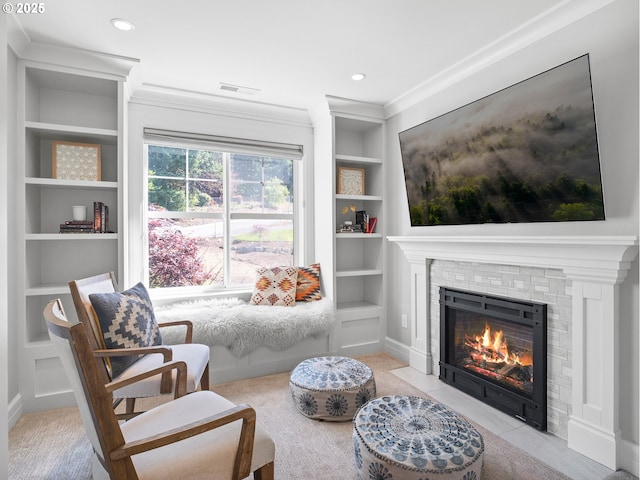 13848 SE Diamond Ridge Rd, Happy Valley, OR 97086 - sitting room featuring built in shelves, a fireplace with flush hearth, crown molding, and recessed lighting