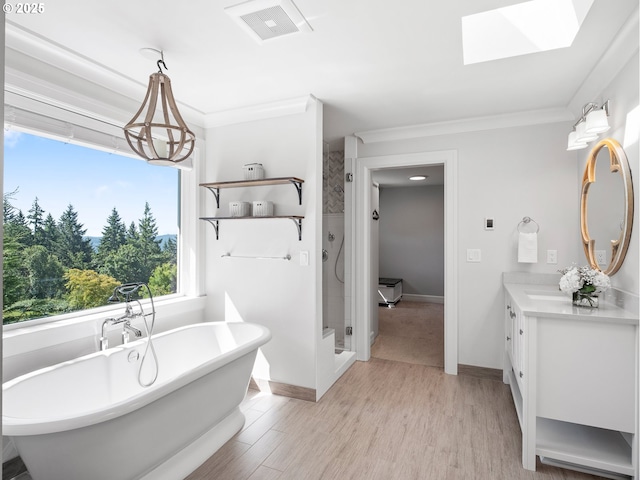13848 SE Diamond Ridge Rd, Happy Valley, OR 97086 - full bathroom with vanity, a shower stall, ornamental molding, a soaking tub, and a skylight