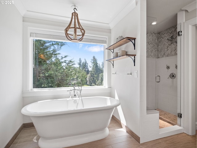 13848 SE Diamond Ridge Rd, Happy Valley, OR 97086 - bathroom featuring a stall shower, a soaking tub, baseboards, and wood finished floors