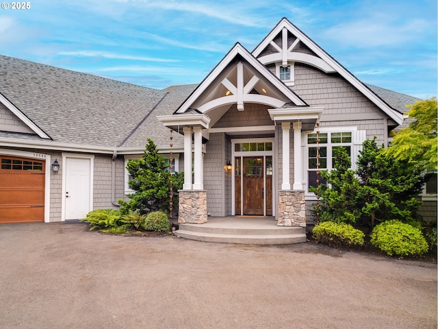 13848 SE Diamond Ridge Rd, Happy Valley, OR 97086 - craftsman inspired home with roof with shingles, a garage, and stone siding