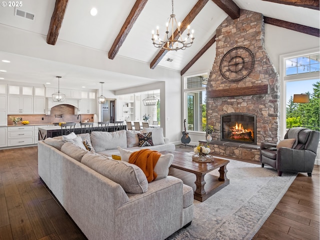 13848 SE Diamond Ridge Rd, Happy Valley, OR 97086 - living room with a fireplace, a chandelier, dark wood finished floors, beam ceiling, and recessed lighting