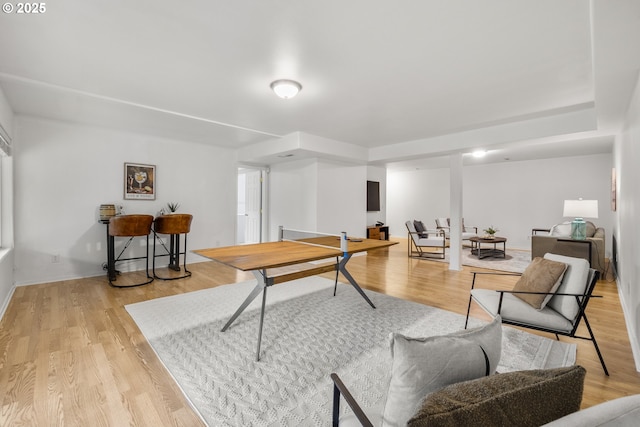 playroom with light wood-style flooring and baseboards