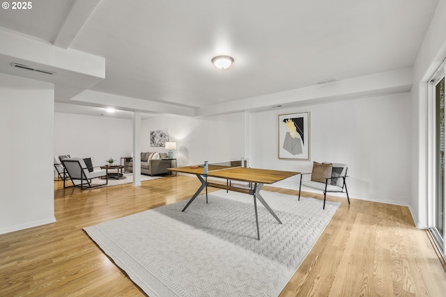 rec room featuring light wood-style flooring and baseboards