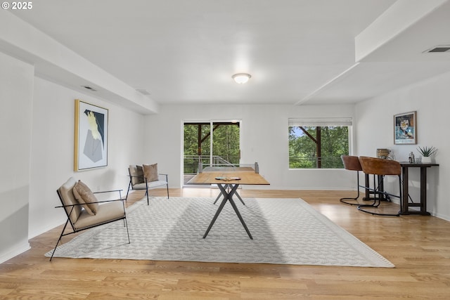 sitting room with wood finished floors and baseboards