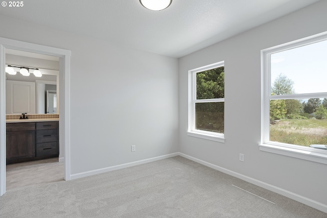 195 SE Acacia Dr, Gresham, OR 97080 - unfurnished bedroom with light colored carpet and ensuite bathroom
