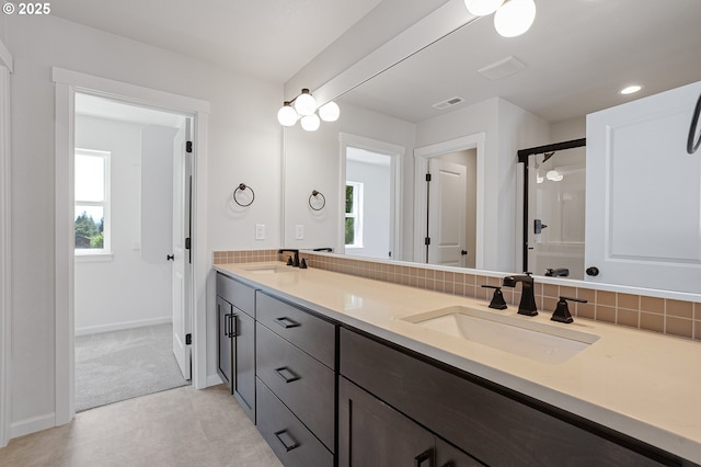 195 SE Acacia Dr, Gresham, OR 97080 - bathroom with double vanity, a shower with shower door, and decorative backsplash