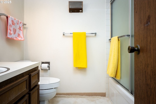 full bathroom featuring bath / shower combo with glass door, toilet, and vanity