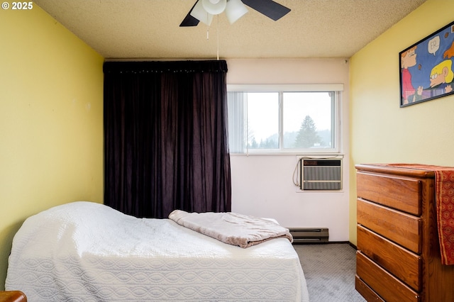 carpeted bedroom featuring a textured ceiling, baseboard heating, a wall mounted air conditioner, and ceiling fan