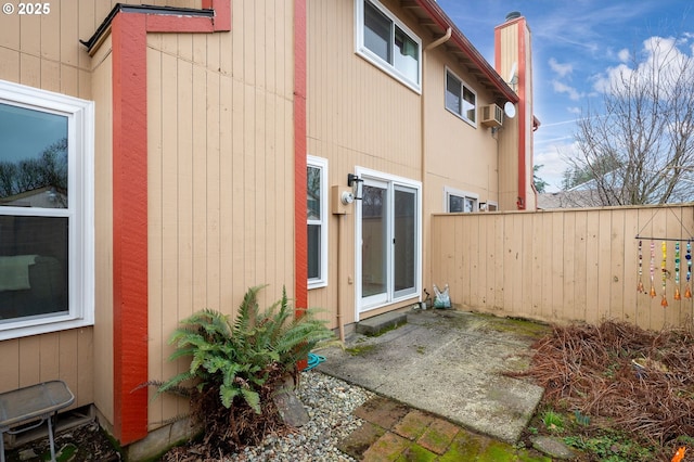 view of side of home featuring a patio