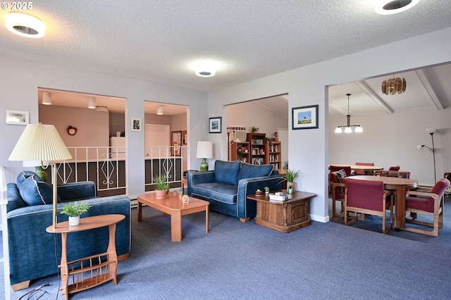 living room with a textured ceiling, beamed ceiling, and carpet flooring