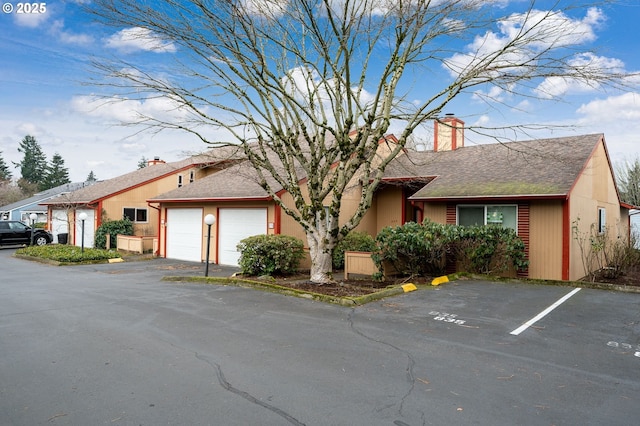 single story home featuring a garage