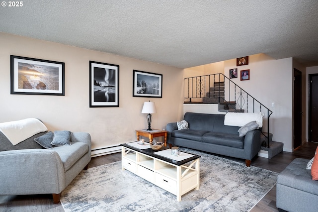 living room with a baseboard radiator, a textured ceiling, and hardwood / wood-style flooring