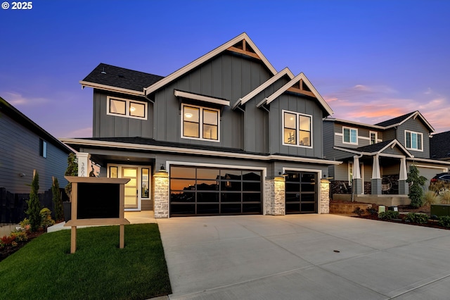 3800 W 2nd St, Washougal, WA 98671 - view of front of home with an attached garage, board and batten siding, concrete driveway, and stone siding