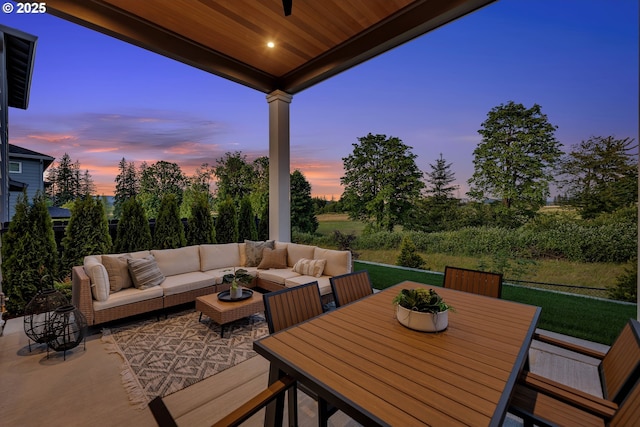 3800 W 2nd St, Washougal, WA 98671 - patio terrace at dusk with an outdoor living space, a patio area, and a lawn