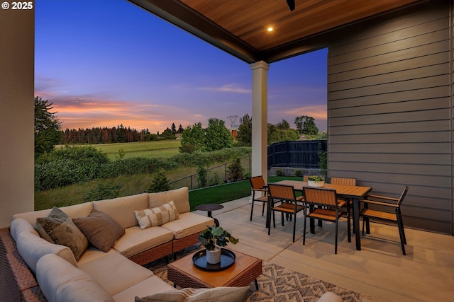 3800 W 2nd St, Washougal, WA 98671 - patio terrace at dusk with an outdoor living space, outdoor dining area, a patio, and a fenced backyard