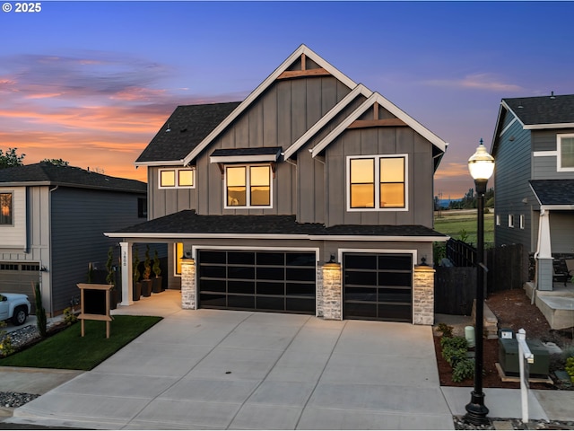 3800 W 2nd St, Washougal, WA 98671 - view of front of property with board and batten siding, a garage, concrete driveway, and a shingled roof