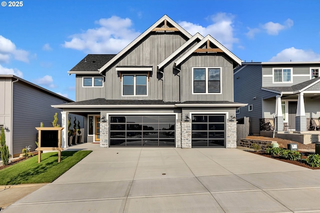 3800 W 2nd St, Washougal, WA 98671 - craftsman-style home with an attached garage, stone siding, concrete driveway, and board and batten siding