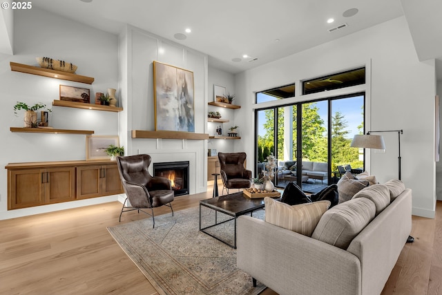 3800 W 2nd St, Washougal, WA 98671 - living area with a large fireplace, light wood-type flooring, and recessed lighting