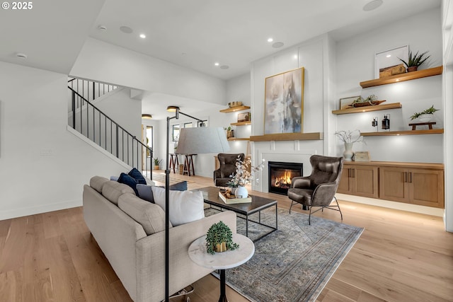 3800 W 2nd St, Washougal, WA 98671 - living area with stairway, light wood-style flooring, a glass covered fireplace, and recessed lighting