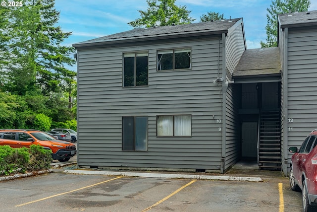 6745 SW Scholls Ferry Rd Unit 10, Beaverton, OR 97008 - view of side of property featuring uncovered parking, crawl space, and roof with shingles