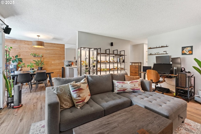 6745 SW Scholls Ferry Rd Unit 10, Beaverton, OR 97008 - living area featuring wooden walls, light wood finished floors, and a textured ceiling