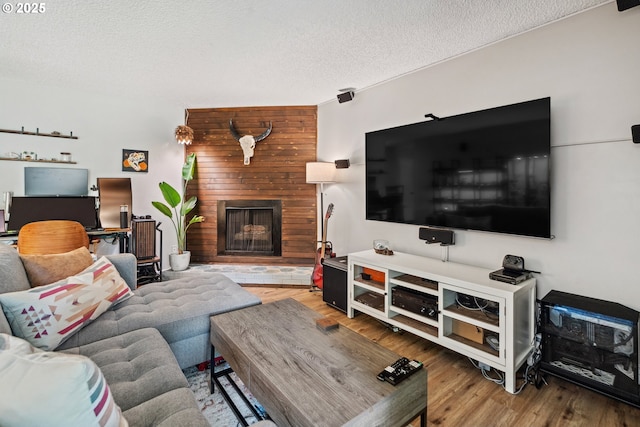 6745 SW Scholls Ferry Rd Unit 10, Beaverton, OR 97008 - living area with a fireplace, wood finished floors, and a textured ceiling
