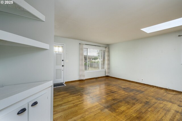 140 Canemah Rd, Oregon City, OR 97045 - unfurnished living room featuring a skylight and wood finished floors