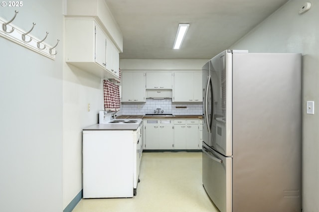 140 Canemah Rd, Oregon City, OR 97045 - kitchen featuring stainless steel fridge with ice dispenser, backsplash, and white cabinetry