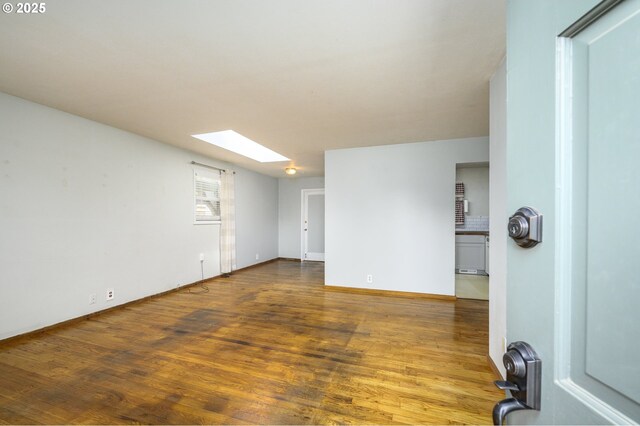 140 Canemah Rd, Oregon City, OR 97045 - unfurnished room featuring a skylight, wood finished floors, and baseboards