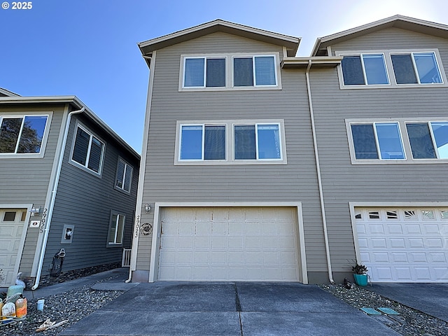 view of front of home with an attached garage and driveway