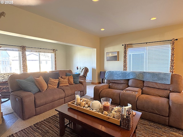 carpeted living room with recessed lighting and baseboards