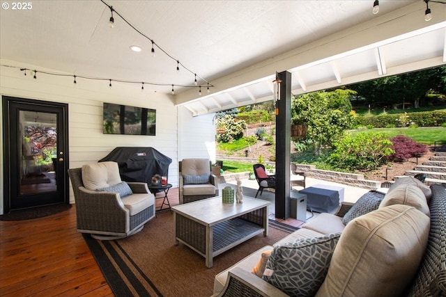 view of patio / terrace with an outdoor hangout area, a wooden deck, and a grill